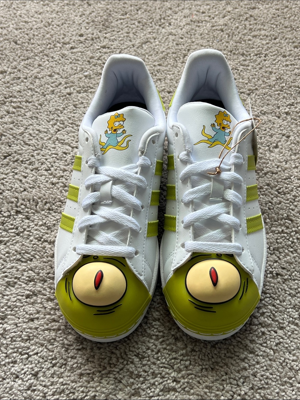adidas White Sneakers with Lime Green Accents and Cartoon Toecaps